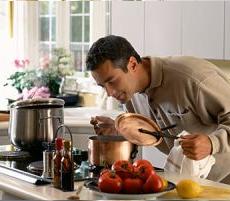 Man cooking, smelling aroma   Original Filename: 200357416-001.jpg